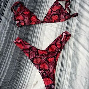 Red snake print bikini never worn size medium !